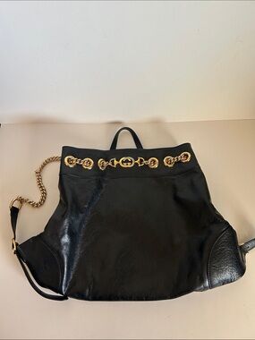 Gucci Black Leather Backpack with Gold Chain Accents